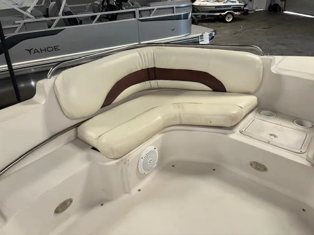 Slide: The Image of 2001 Hurricane Fun Deck GS 201 boat interior with cushioned seating and cup holders. - 11