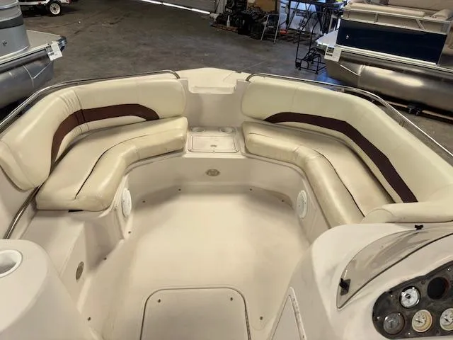 Slide: The Image of 2001 Hurricane Fun Deck GS 201 boat interior with cushioned seating in a garage. - 12