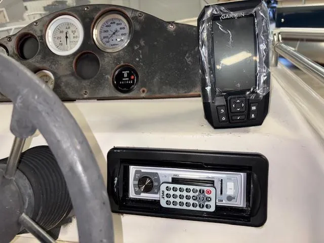 Slide: The Image of Dashboard of 2001 Hurricane Fun Deck GS 201 with Garmin GPS and stereo system. - 15