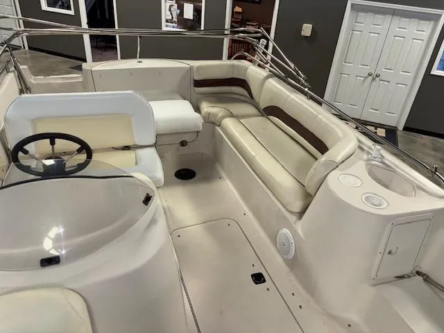 Slide: The Image of 2001 Hurricane Fun Deck GS 201 boat interior with seating and steering wheel. - 17