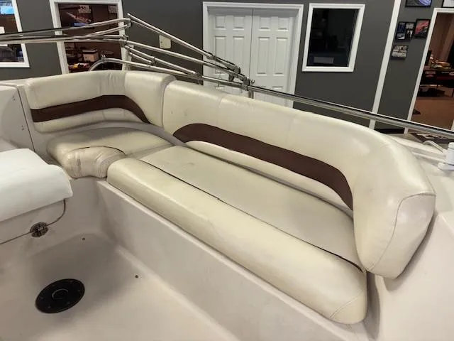 Slide: The Image of 2001 Hurricane Fun Deck GS 201 boat interior with beige and brown seating. - 18