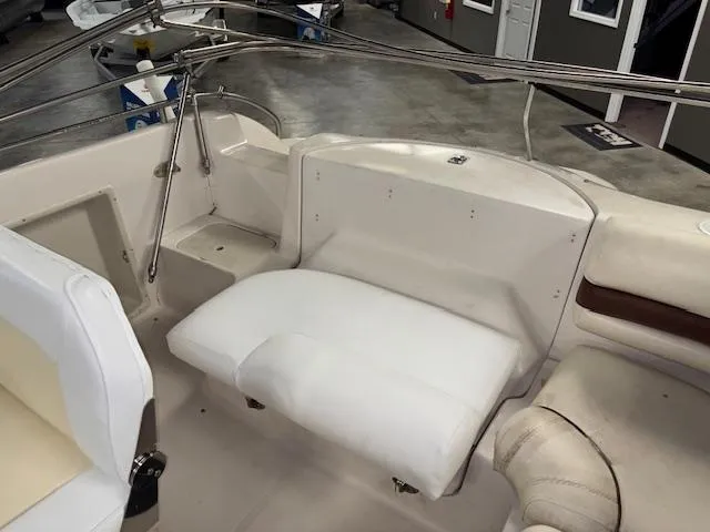 Slide: The Image of 2001 Hurricane Fun Deck GS 201 boat interior with white seating and metal railings. - 20