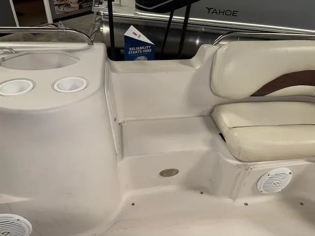 Slide: The Image of 2001 Hurricane Fun Deck GS 201 boat interior with seating and cup holders. - 22