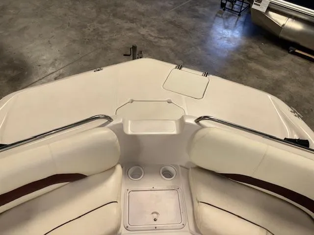 Slide: The Image of 2001 Hurricane Fun Deck GS 201 boat interior with seating and cup holders. - 24