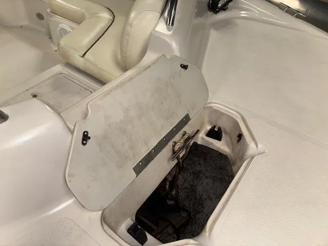 Slide: The Image of 2001 Hurricane Fun Deck GS 201 boat interior with open storage compartment. - 27