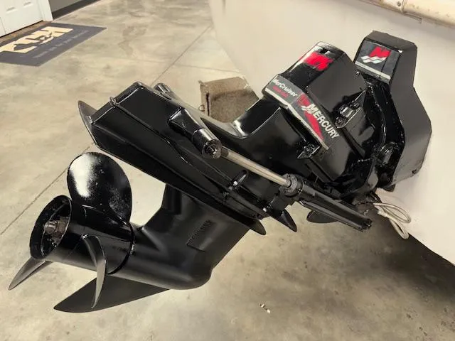 Slide: The Image of Outboard motor of a 2001 Hurricane Fun Deck GS 201 boat in a garage. - 28
