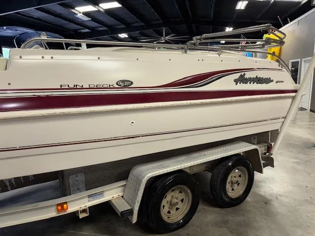 Slide: The Image of 2001 Hurricane Fun Deck GS 201 boat on trailer in indoor storage. - 3