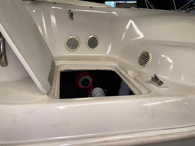 Slide: The Image of 2001 Hurricane Fun Deck GS 201 boat interior with open storage compartment. - 30