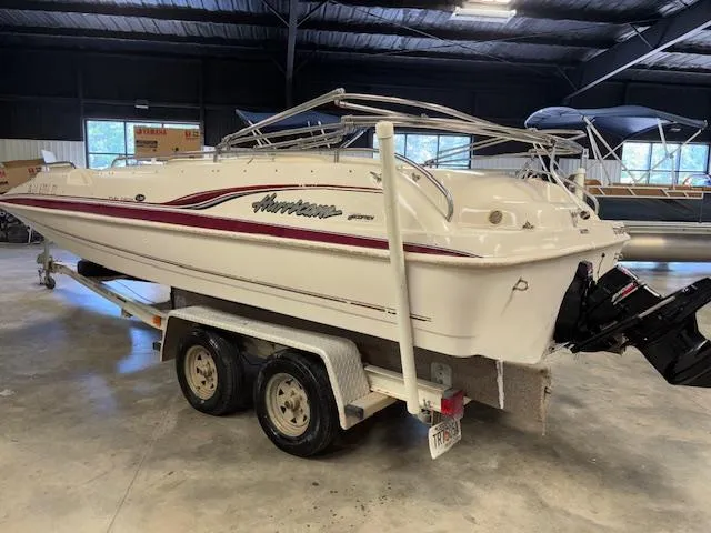 Slide: The Image of 2001 Hurricane Fun Deck GS 201 boat on trailer in indoor storage. - 4