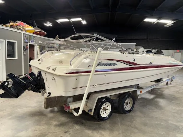 Slide: The Image of 2001 Hurricane Fun Deck GS 201 boat on trailer in indoor storage. - 5
