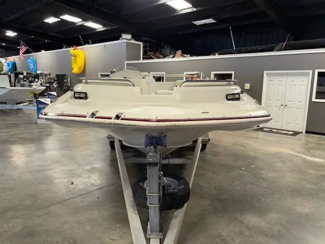 Slide: The Image of 2001 Hurricane Fun Deck GS 201 boat on trailer in indoor showroom. - 9