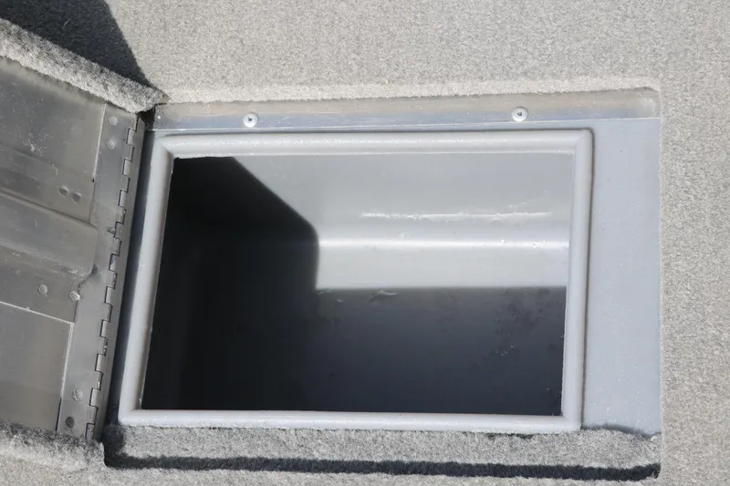 Slide: The Image of Open storage compartment in 2013 Tracker Pro V16 Guide WT boat. - 15