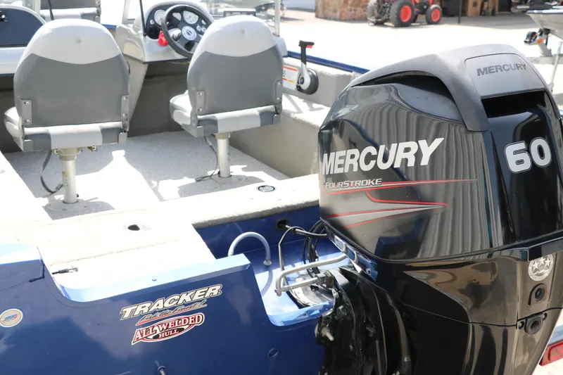 Slide: The Image of 2013 Tracker Pro V16 Guide WT boat with Mercury 60 FourStroke engine. - 16