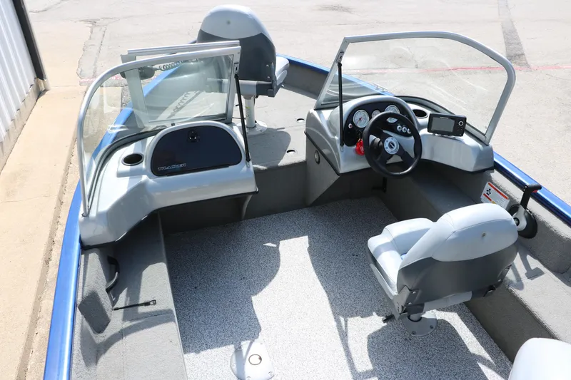 Slide: The Image of 2013 Tracker Pro V16 Guide WT boat interior with steering console and seating. - 6