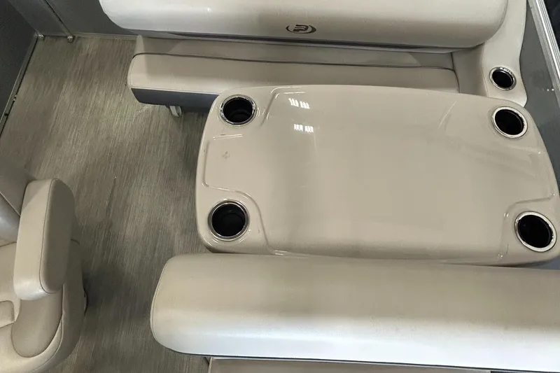 Slide: The Image of 2020 Princecraft Vectra 21 boat interior with beige seating and cup holders. - 15
