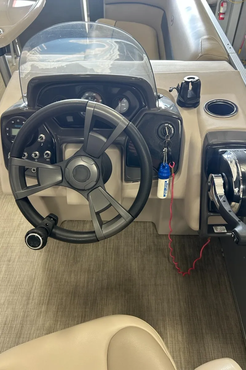 Slide: The Image of 2020 Princecraft Vectra 21 boat dashboard with steering wheel and controls. - 18