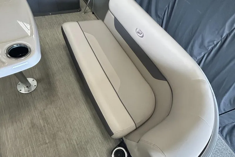 Slide: The Image of 2020 Princecraft Vectra 21 boat interior with beige seating and table with cup holder. - 23