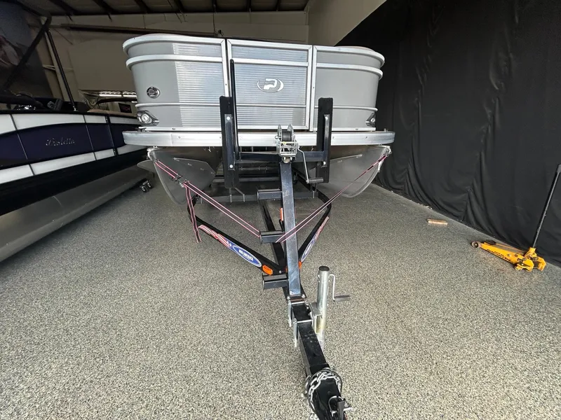 Slide: The Image of 2020 Princecraft Vectra 21 pontoon boat on trailer in indoor storage. - 6