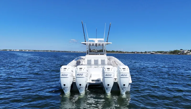 Slide: The Image of 2020 Invincible 37 Catamaran with four 400 horsepower engines on open water. - 1