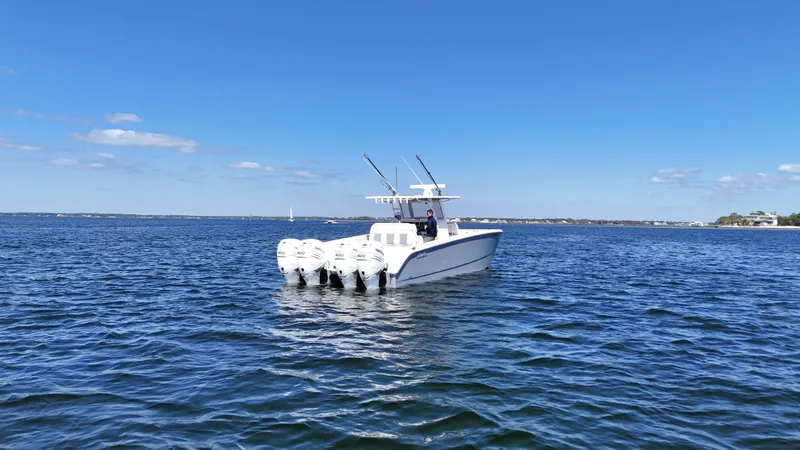 Slide: The Image of 2020 Invincible 37 Catamaran on open water with clear blue sky. - 2