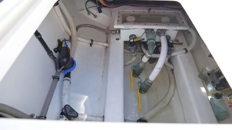 Slide: The Image of Bilge area of 2020 Invincible 37 Catamaran with plumbing and valves. - 22