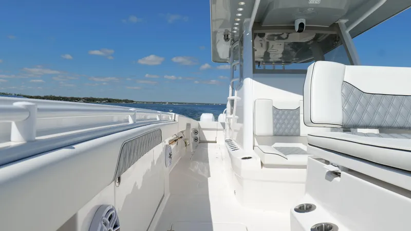 Slide: The Image of 2020 Invincible 37 Catamaran with sleek seating, cruising on a sunny day. - 29