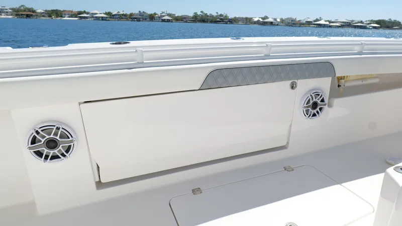 Slide: The Image of Invincible 37 Catamaran 2020 deck view with speakers and storage compartment. - 41