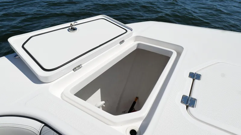 Slide: The Image of Open storage compartment on 2020 Invincible 37 Catamaran, with ocean background. - 43