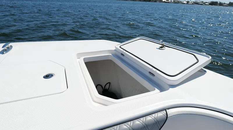 Slide: The Image of Open storage compartment on 2020 Invincible 37 Catamaran, with ocean backdrop. - 45