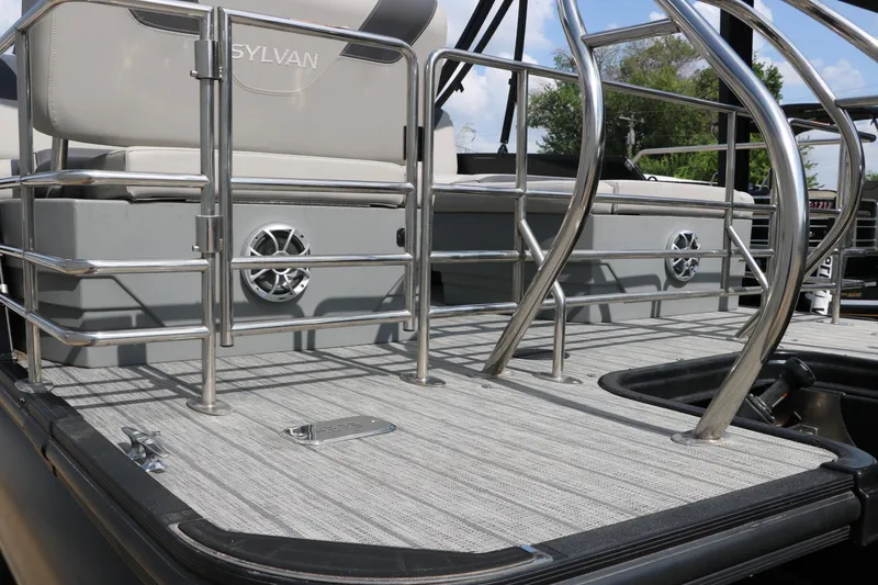 Slide: The Image of 2022 Sylvan L3 RLZ pontoon boat deck with stainless steel railings and seating. - 12