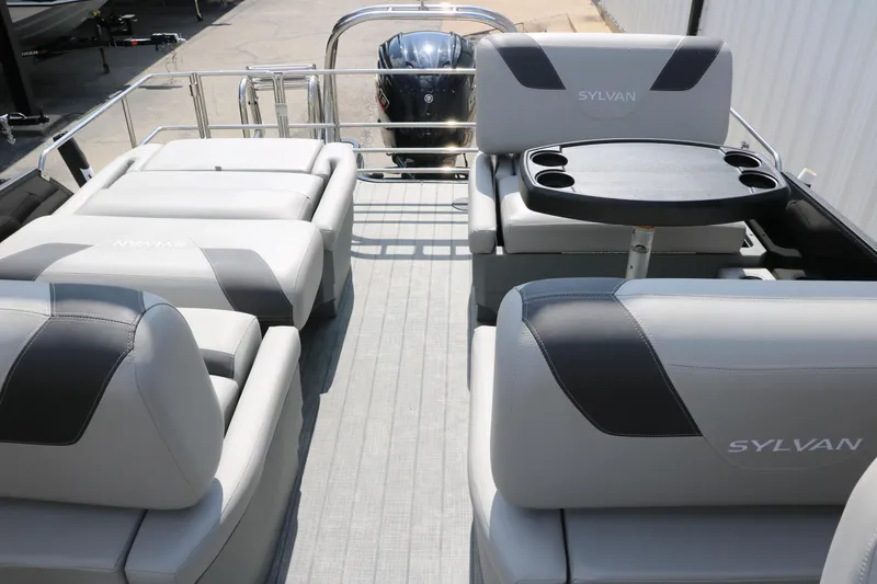 Slide: The Image of 2022 Sylvan L3 RLZ pontoon boat interior with gray seating and cup holders. - 18