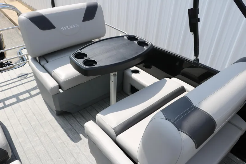 Slide: The Image of 2022 Sylvan L3 RLZ boat interior with gray seating and a black table. - 20