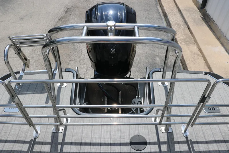 Slide: The Image of 2022 Sylvan L3 RLZ boat with stainless steel railing and outboard motor. - 21