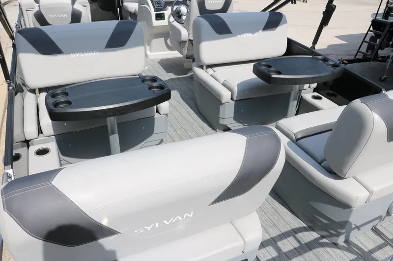 Slide: The Image of 2022 Sylvan L3 RLZ boat interior with gray seating and cup holders. - 24