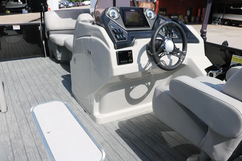 Slide: The Image of 2022 Sylvan L3 RLZ boat interior with steering console and seating. - 29