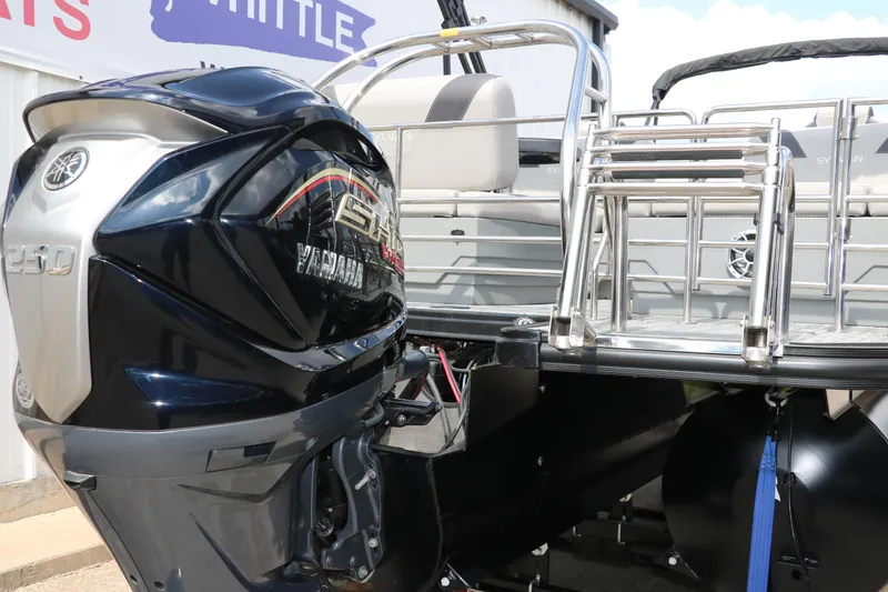 Slide: The Image of 2022 Sylvan L3 RLZ boat with Yamaha 250 engine, rear view showing ladder and seating. - 3