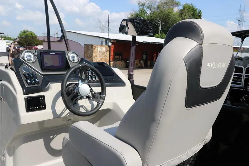 Slide: The Image of 2022 Sylvan L3 RLZ boat interior with steering wheel and control panel. - 30