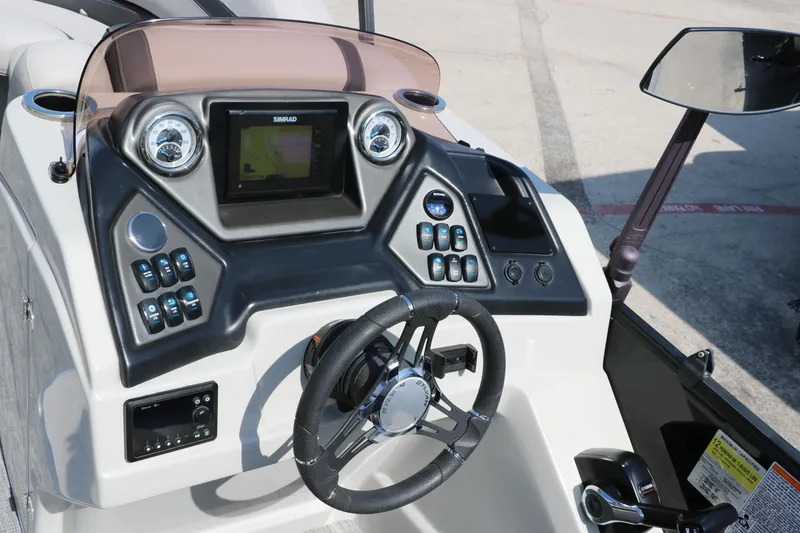 Slide: The Image of 2022 Sylvan L3 RLZ boat dashboard with steering wheel and control panel. - 33