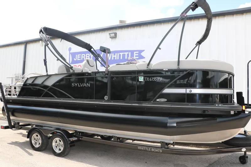 Slide: The Image of 2022 Sylvan L3 RLZ pontoon boat on trailer, displayed outdoors. - 4