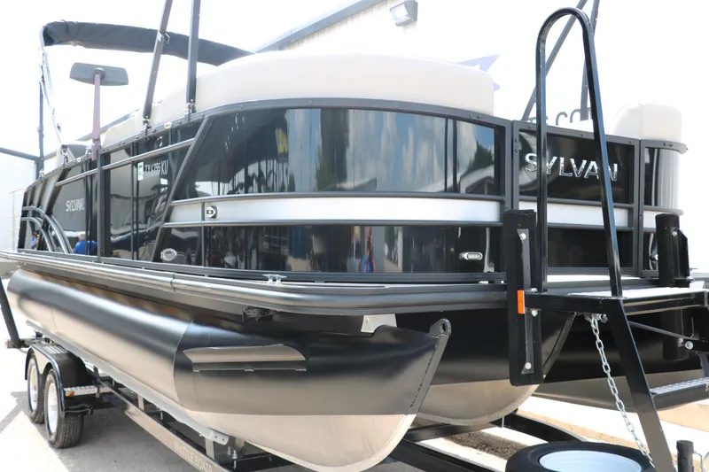 Slide: The Image of 2022 Sylvan L3 RLZ pontoon boat on trailer, black exterior, side view. - 6