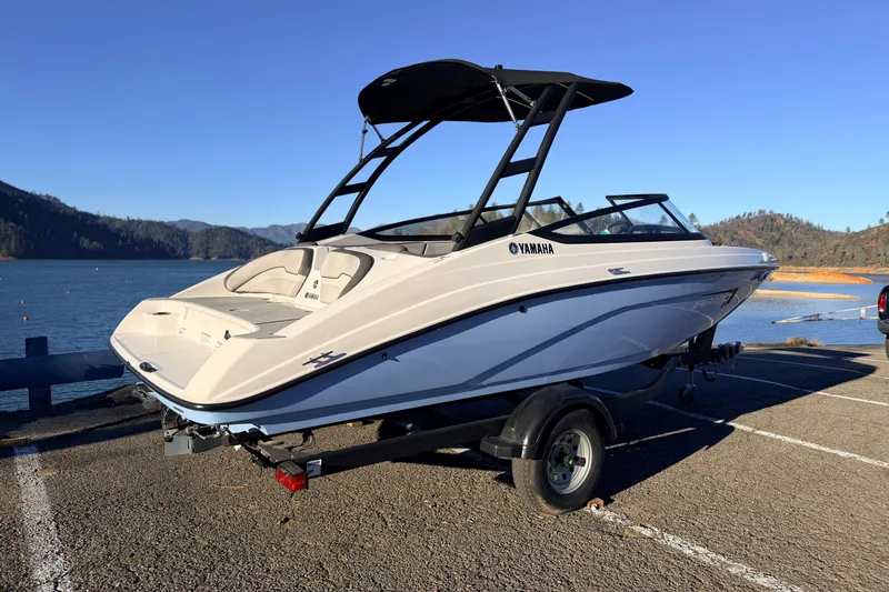 Slide: The Image of 2025 Yamaha AR190 boat on trailer by scenic lake and mountains. - 17