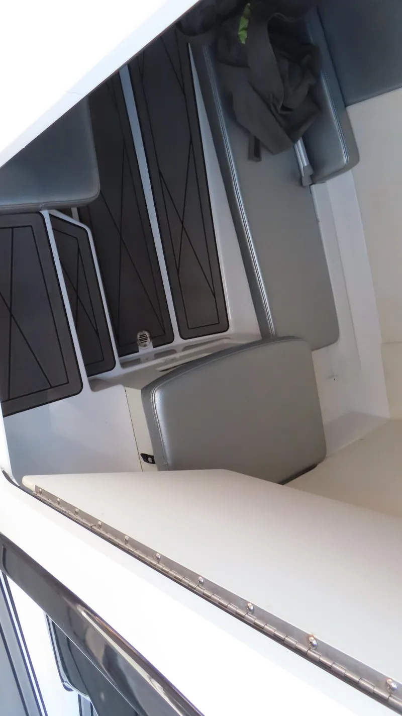 Slide: The Image of 2017 Sunsation 32 CCX boat interior with gray seating and sleek design. - 11