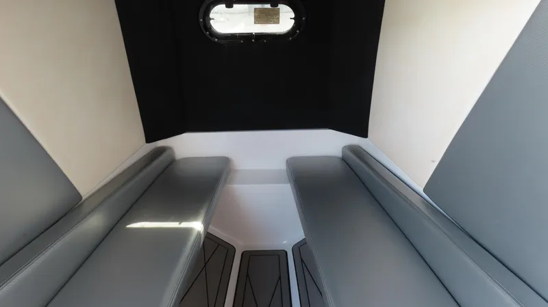 Slide: The Image of Interior cabin of 2017 Sunsation 32 CCX boat with gray seating and small window. - 13