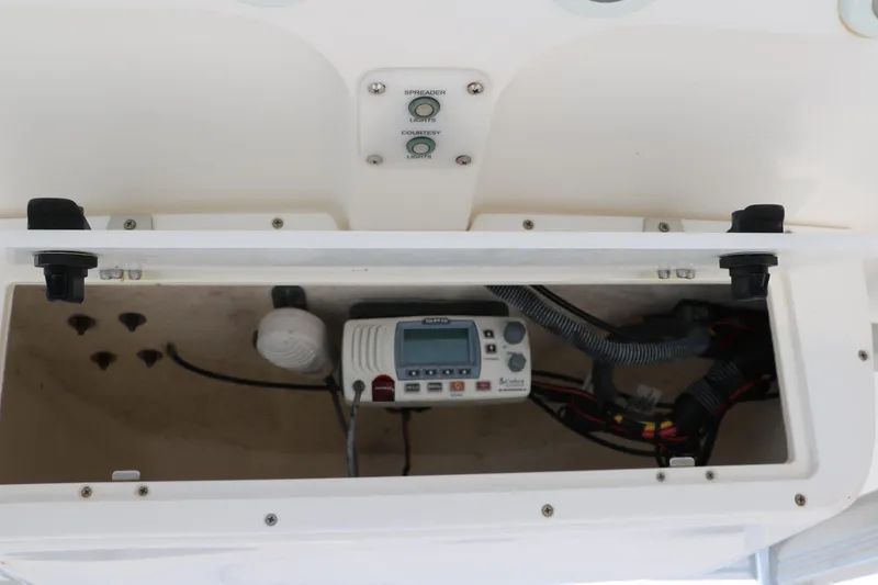 Slide: The Image of 2015 Sea Hunt BX22BR boat console with electronic equipment and wiring. - 33