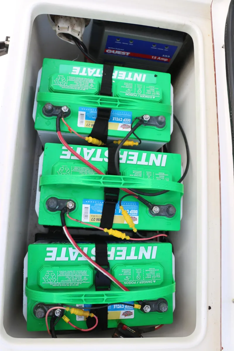 Slide: The Image of Three Interstate batteries in a 2015 Sea Hunt BX22BR boat compartment. - 37