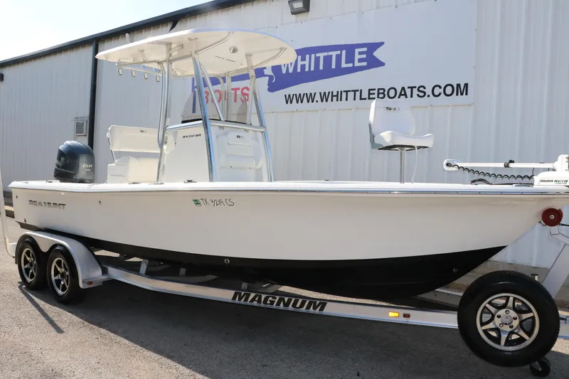 Slide: The Image of 2015 Sea Hunt BX22BR boat on trailer at Whittle Boats dealership. - 4
