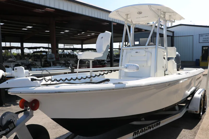 Slide: The Image of 2015 Sea Hunt BX22BR boat on trailer in marina setting. - 6