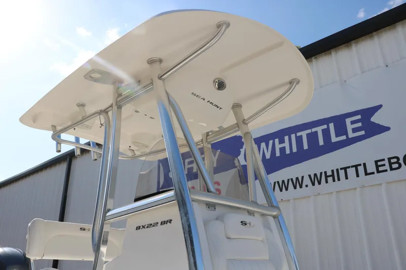 Slide: The Image of 2015 Sea Hunt BX22BR boat with T-top, displayed at Whittle Boats dealership. - 8