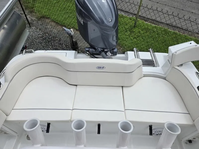 Slide: The Image of 2025 Sea Hunt Ultra 219 boat with Yamaha outboard motor and cushioned seating. - 11