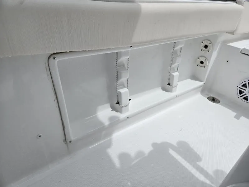 Slide: The Image of Interior view of 2025 Sea Hunt Ultra 219 boat, featuring seating and storage compartments. - 14